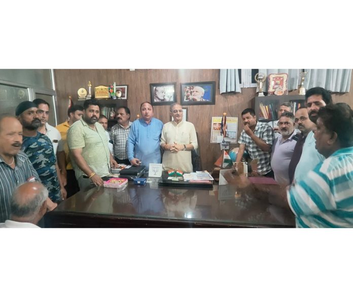 Senior BJP leader Kavinder Gupta with members of Nai Basti shopkeepers’ delegation at his office in Jammu. Senior BJP leader Kavinder Gupta with members of Nai Basti shopkeepers’ delegation at his office in Jammu.