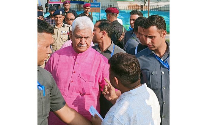 LG Manoj Sinha interacting with pilgrims at Pantha Chowk in Srinagar.
