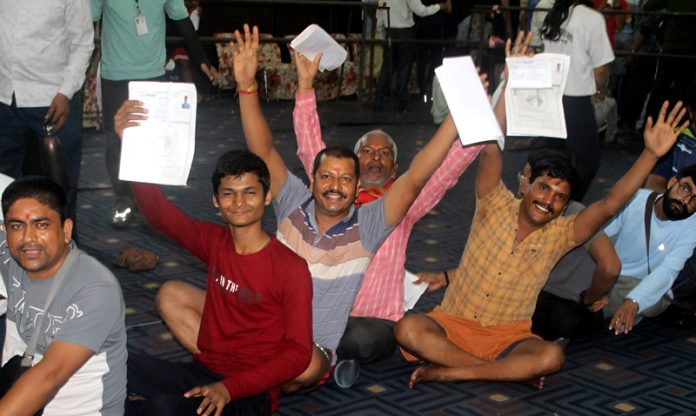 Shri Amarnath Ji bound yatris waiting for their registration at Mahajan Hall, Jammu on Friday. — Excelsior/Rakesh