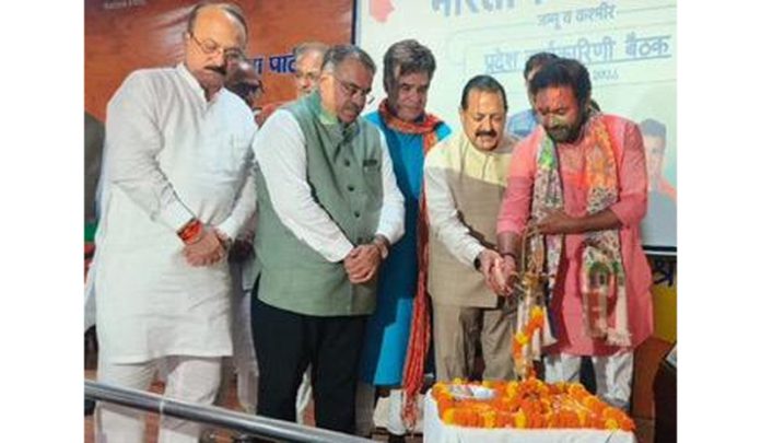 BJP leaders lighting the traditional lamp at party’s office bearers meeting at Jammu on Friday. —Excelsior/Rakesh