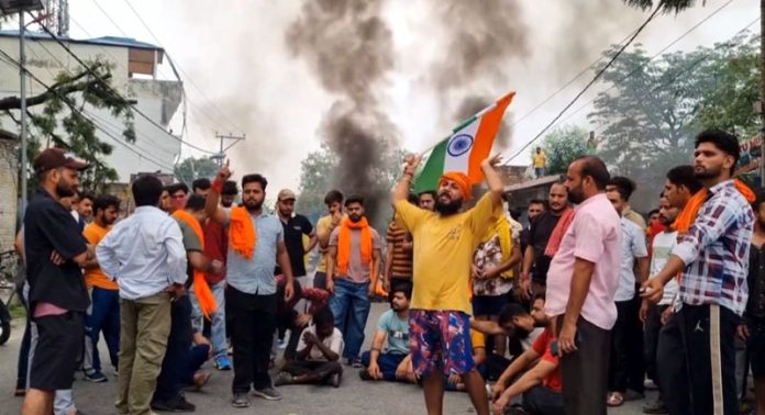 People protesting against vandalism of a temple at Reasi town on Monday. -Excelsior/Romesh Mengi