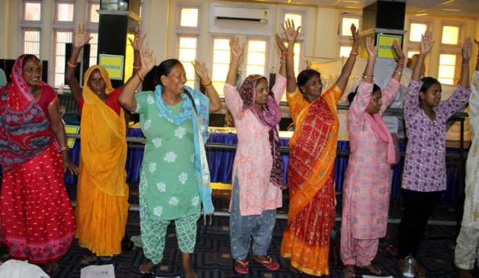 Shri Amarnath Ji bound Yatris chanting 'Bum Bum Bhole' at Mahajan Hall Jammu on Monday. -Excelsior/Rakesh