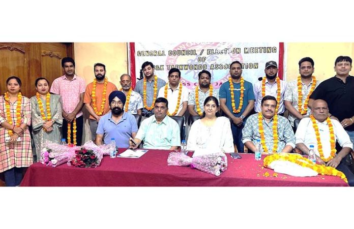 Newly elected members of J&K Taekwondo Association posing along with returning officers, observers and dignitaries. Newly elected members of J&K Taekwondo Association posing along with returning officers, observers and dignitaries.
