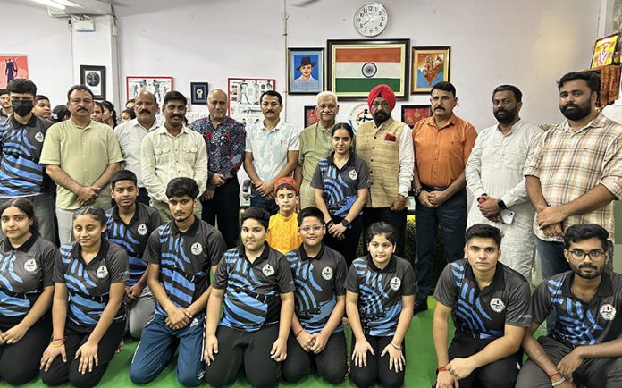 Aspiring shooters posing along with dignitaries during an event at Jammu.