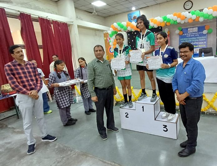 Players posing along with certificates on podium during KVS Regional Sports Meet 2024-25. Players posing along with certificates on podium during KVS Regional Sports Meet 2024-25.