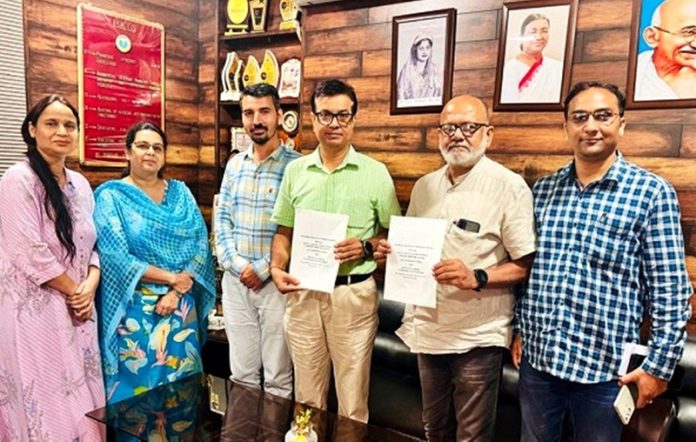 Principal GCW Parade and Director Rangyug displaying copies of MoU.