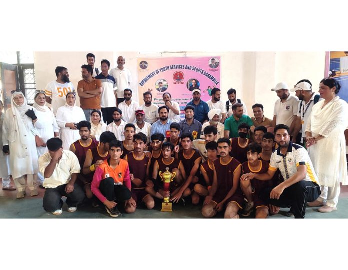 Winning team posing along with trophy and dignitaries at Baramulla on Saturday.