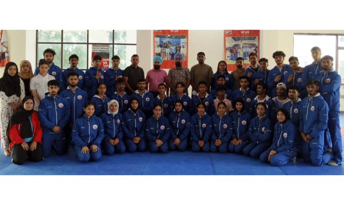 J&K Junior Wushu team posing with officials of JKSC and Association members.