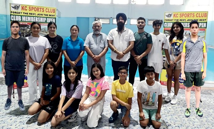 Selected swimmers posing with JKSA president Ramandeep Singh Soodan and other office bearers.