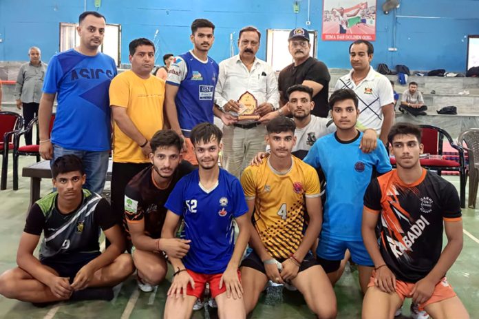 Winning team posing with guests and sports officials.