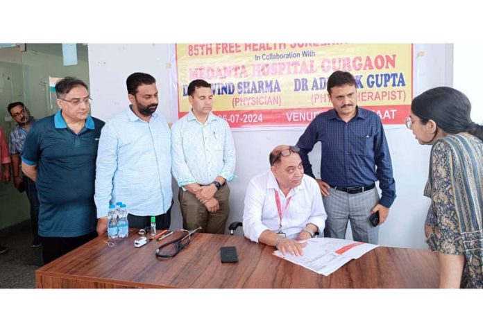 A doctor talking to a patient during a medical camp at Jammu on Friday.