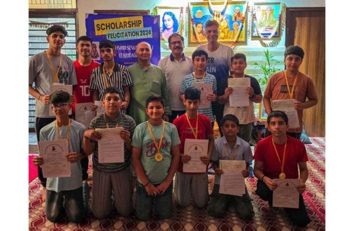 Students who were given scholarships of KSS and Sharika Foundation at Jammu posing for a photograph with organisers of function. Students who were given scholarships of KSS and Sharika Foundation at Jammu posing for a photograph with organisers of function.