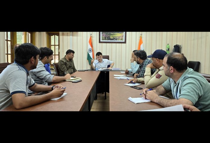 DDC Baramulla Minga Sherpa chairing a meeting on Monday.