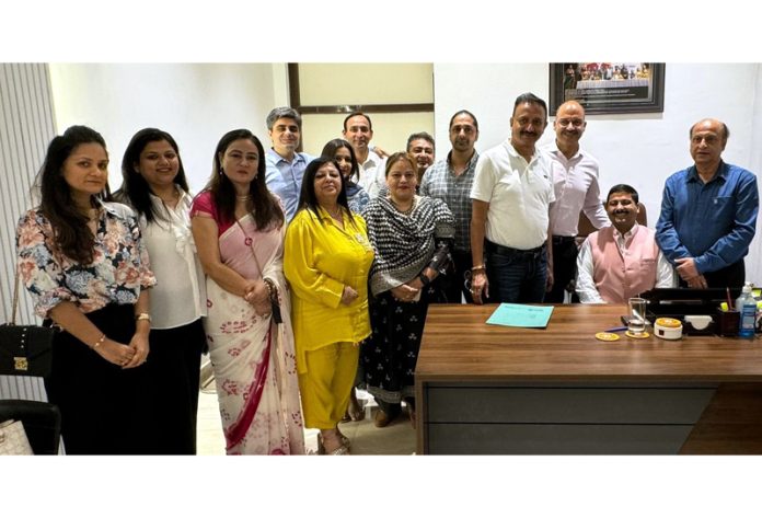 Gaurav Gupta posing along with other members of Jammu Club during a function held in Jammu on Wednesday.