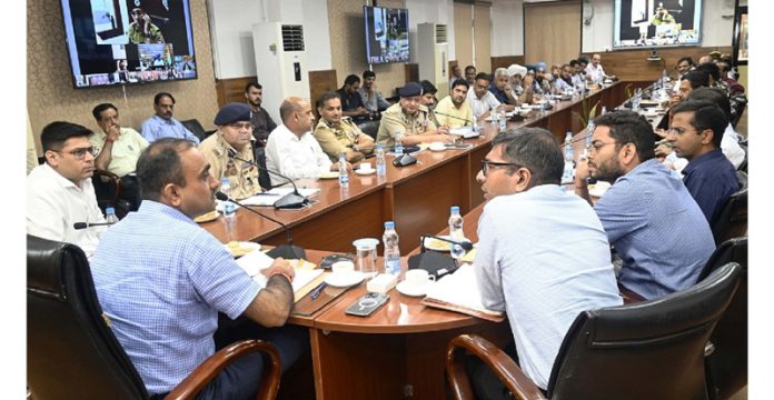 Div Com Jammu chairing a meeting on Tuesday.