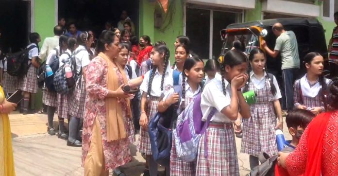 School children being evacuated from area after leakage of Chlorine gas from filtration plant. — Excelsior/K Kumar