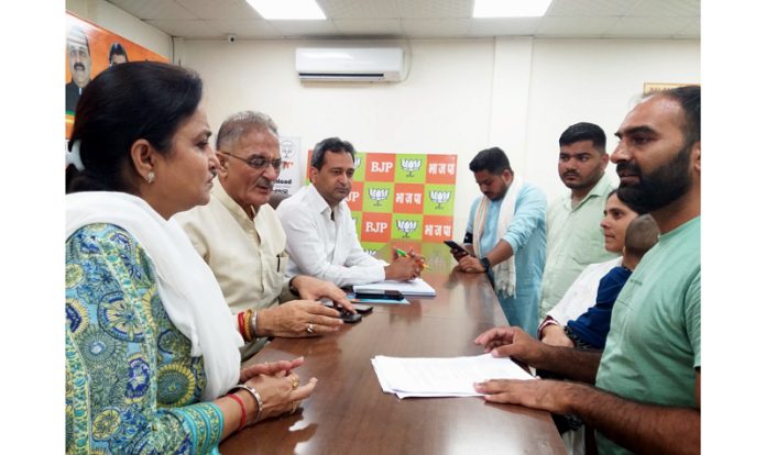 BJP leaders listening public grievances at Party headquarters Trikuta Nagar on Tuesday. BJP leaders listening public grievances at Party headquarters Trikuta Nagar on Tuesday.