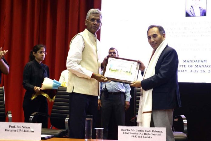 A dignitary welcoming Chief Justice Tashi Rabstan at IIM Jammu on Friday.