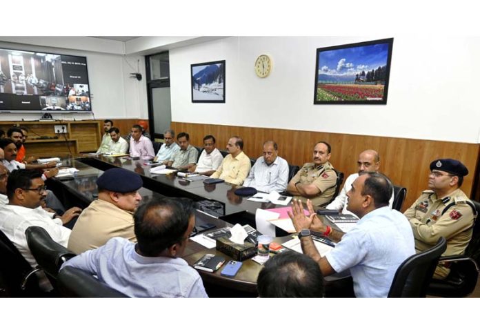 Div Com chairing a meeting at Jammu on Friday.