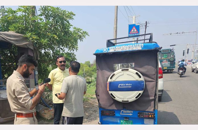 MVD team inspecting an e-rickshaw during a drive against violations in Jammu on Thursday. MVD team inspecting an e-rickshaw during a drive against violations in Jammu on Thursday.