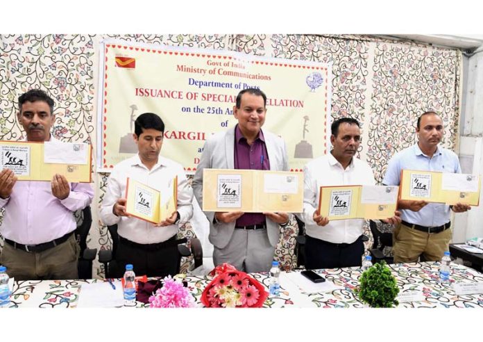 Chief Postmaster General, J&K Circle, Amitabh Singh along with other officials during the release of a Special Cancellation Stamp to commemorate Vijay Diwas at GPO Srinagar on Friday. -Excelsior/Shakeel Chief Postmaster General, J&K Circle, Amitabh Singh along with other officials during the release of a Special Cancellation Stamp to commemorate Vijay Diwas at GPO Srinagar on Friday. -Excelsior/Shakeel