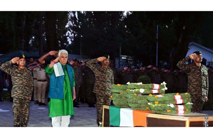 Lt Governor Manoj Sinha paying homage to Naik Dilwar Khan in Kupwara on Wednesday. Lt Governor Manoj Sinha paying homage to Naik Dilwar Khan in Kupwara on Wednesday.