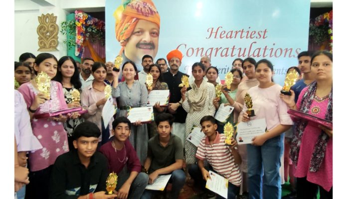 Senior BJP leader Devender Singh Rana along with students of Block Nagrota posing for a group photograph on Sunday.