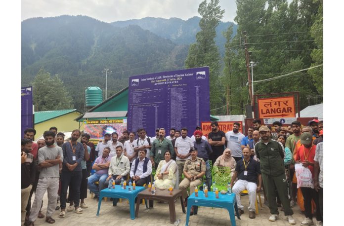 Dignitaries, pilgrims and service providers watching a Nukkad Natak at Nunwan Base camp of Shri Amarnath Yatra. Dignitaries, pilgrims and service providers watching a Nukkad Natak at Nunwan Base camp of Shri Amarnath Yatra.