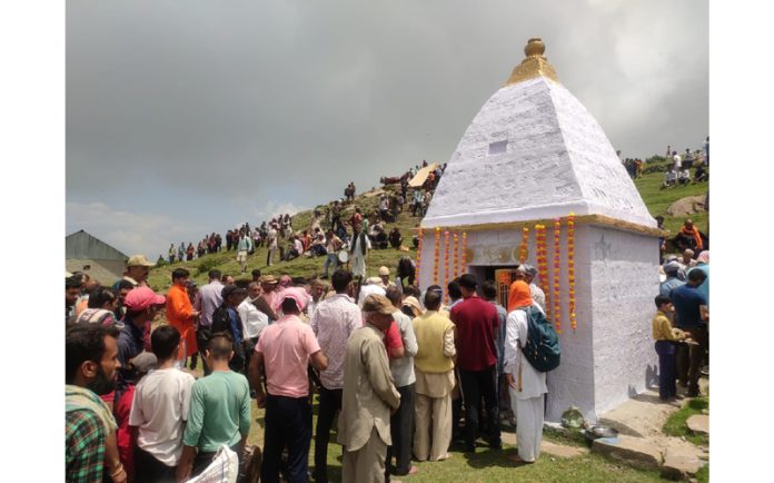 Devotees waiting for their turn to seek divine blessings during annual Sabour Mela at Ladha Dhar. — Excelsior/K Kumar