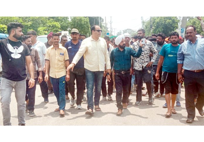 E-Rickshaw operators protest in front of Transport Commissioner’s office in Jammu. E-Rickshaw operators protest in front of Transport Commissioner’s office in Jammu.