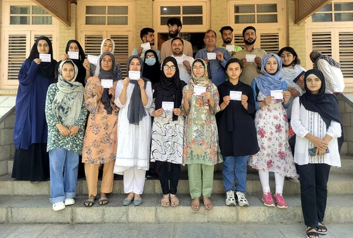 ABVP members posing for a group photograph at the start of membership campaign in Srinagar on Sunday.