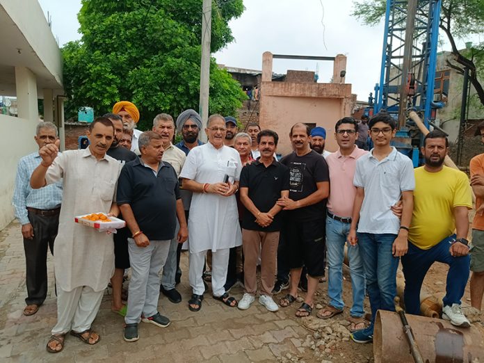 Senior BJP leader Kavinder Gupta posing with others after inaugurating development works in Jammu on Sunday.