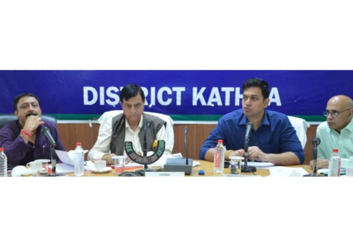 DDC Kathua Chairman chairing a meeting on Monday.