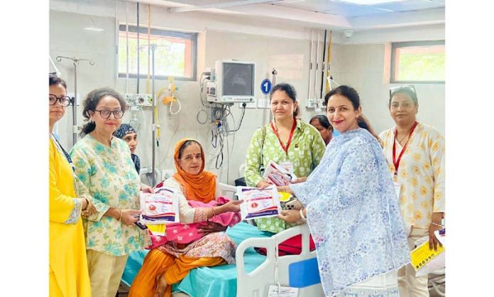 JMI members presenting health and hygiene kit to a patient in Gynaecology ward of Government Hospital, Gandhi Nagar (Jammu). JMI members presenting health and hygiene kit to a patient in Gynaecology ward of Government Hospital, Gandhi Nagar (Jammu).