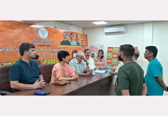 BJP leaders listening public grievances at Jammu on Thursday. BJP leaders listening public grievances at Jammu on Thursday.