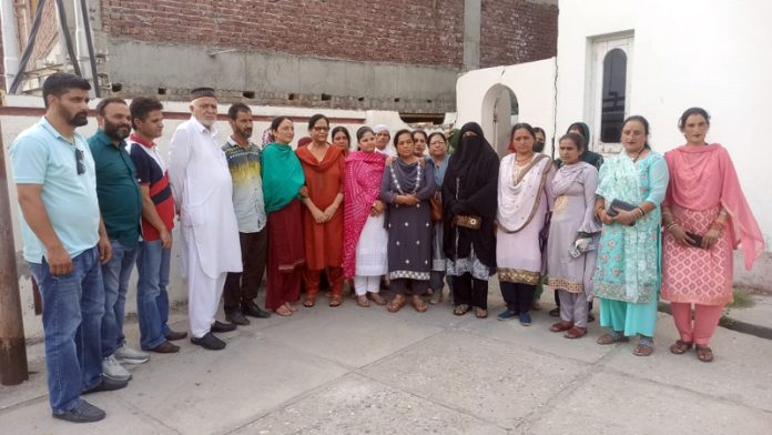 NC's women wing leader Bimla Luthra and others during meeting at Kishtwar.
