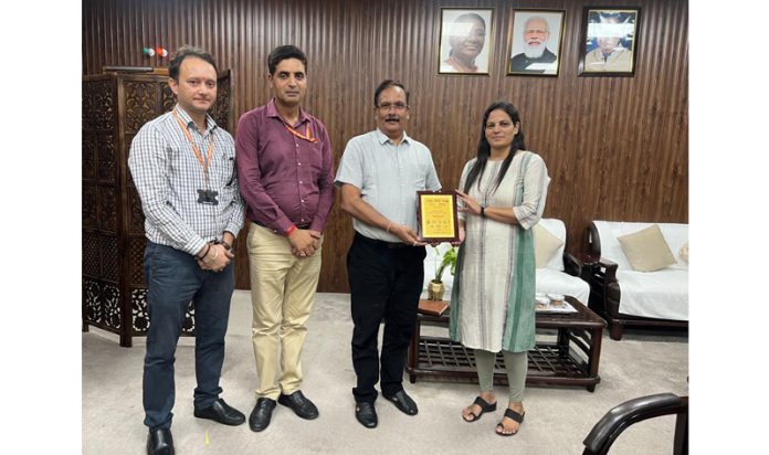 CUJ Vice-Chancellor displaying the award received by the university at Expo-2024.