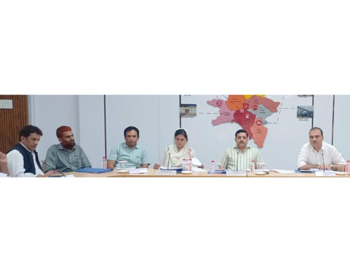DDC Chairman Reasi chairing a meeting.