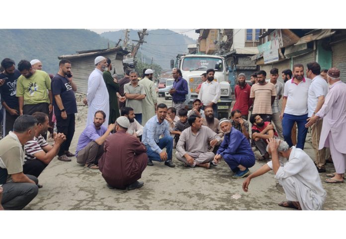 Shopkeepers during a protest in old town in Baramulla on Thursday. —Excelsior/Aabid Nabi