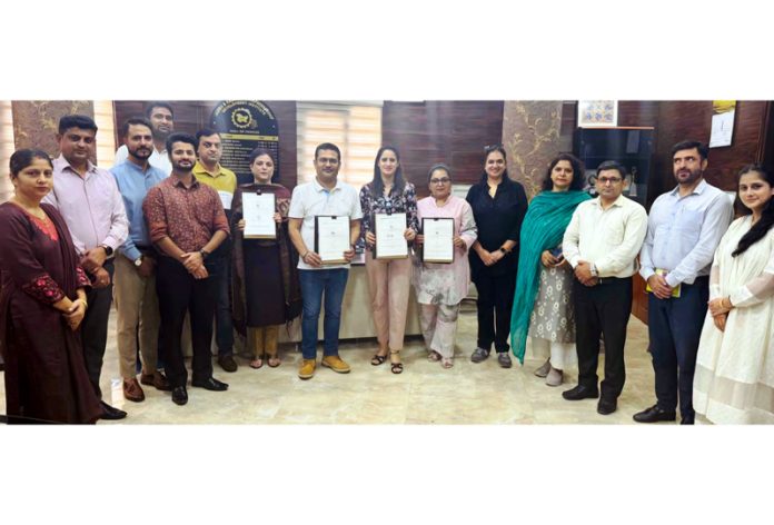 JKEDI officials posing after signing an MoU with Govt Polytechnic College Samba, MIET Jammu and FICCI FLO JKL.