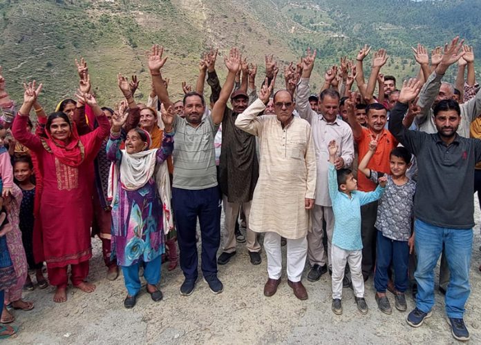Members of Thakur Sabha Bani raise slogans after a meeting on Sunday.