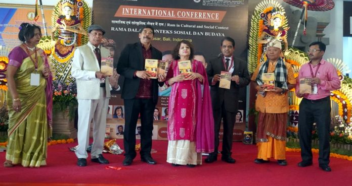 Dr. Anila Singh Charak receiving an award during an event in Indonesia.