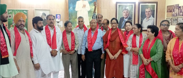 Senior NC leaders Rattan Lal Gupta, Bimla Luthra and others during a joining function at party office in Jammu.