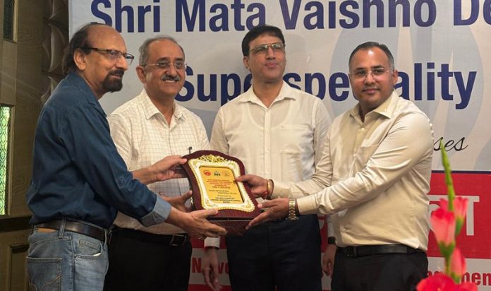 Dr Annil Mahajan receiving a memento during an event at SMVD Narayana Superspeciality Hospital, Katra.