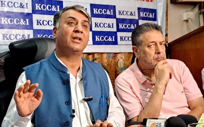 KCCI president Javed Ahmad Tenga along with other chamber members during a press conference in Srinagar on Monday. -Excelsior/Shakeel