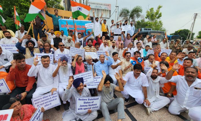 Leaders of opposition parties staging protest at Maharaja Hari Singh Park in Jammu on Saturday.