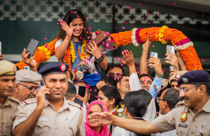 History-Making Manu Bhaker Arrives Home To Enthusiastic Reception