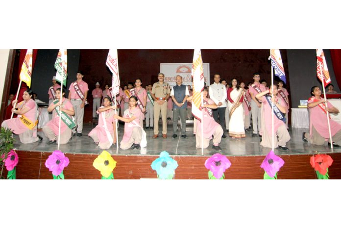 Director of SK Police Academy, Udhampur Garib Dass posing along with newly elected student's council at Jodhamal School.