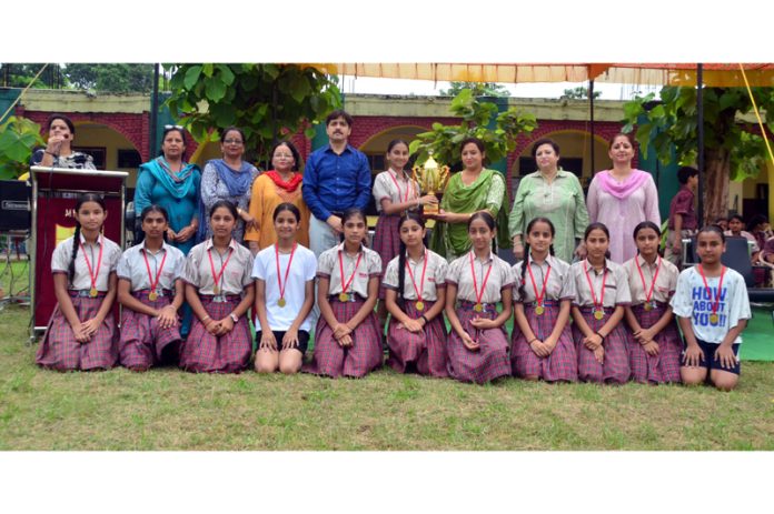 Students of MHAC School, Nagbani posing along with the DAV National Sports 2024 trophy.