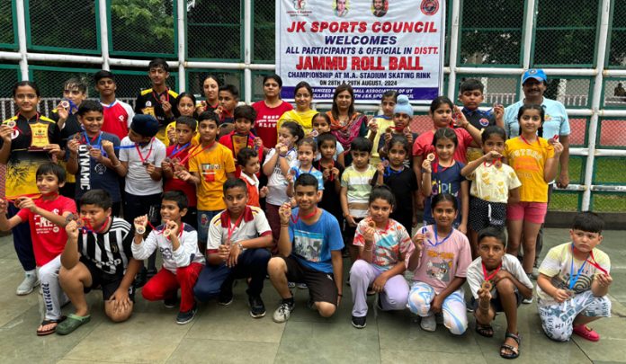 Rollball players posing with medals and match officials during closing ceremony at Jammu.